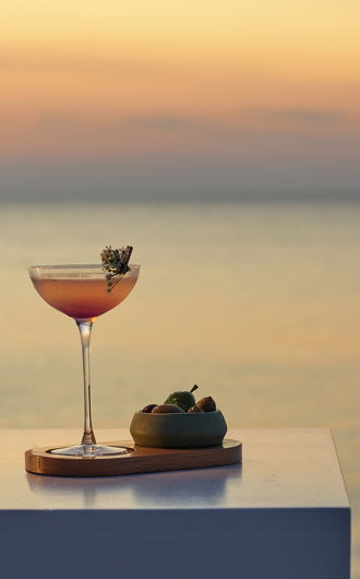 Cocktails next to a lady's hand