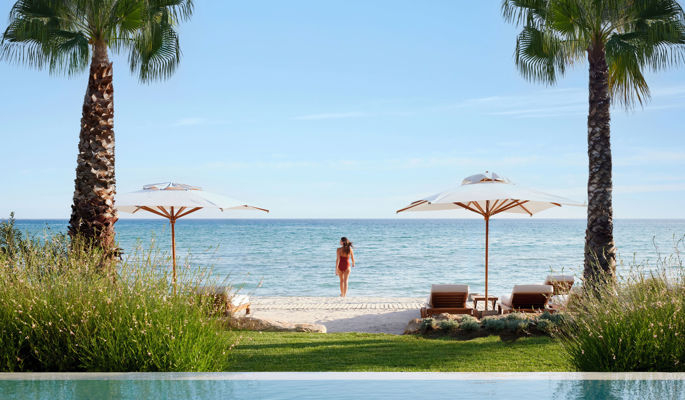 A family enjoying time together at an infinity pool