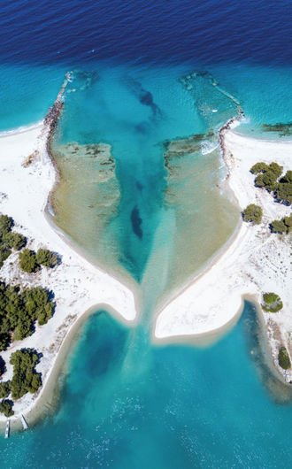 Aerial view of private beaches, forest and wetlands