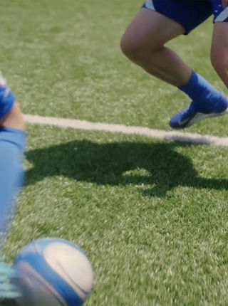 Two people playing football