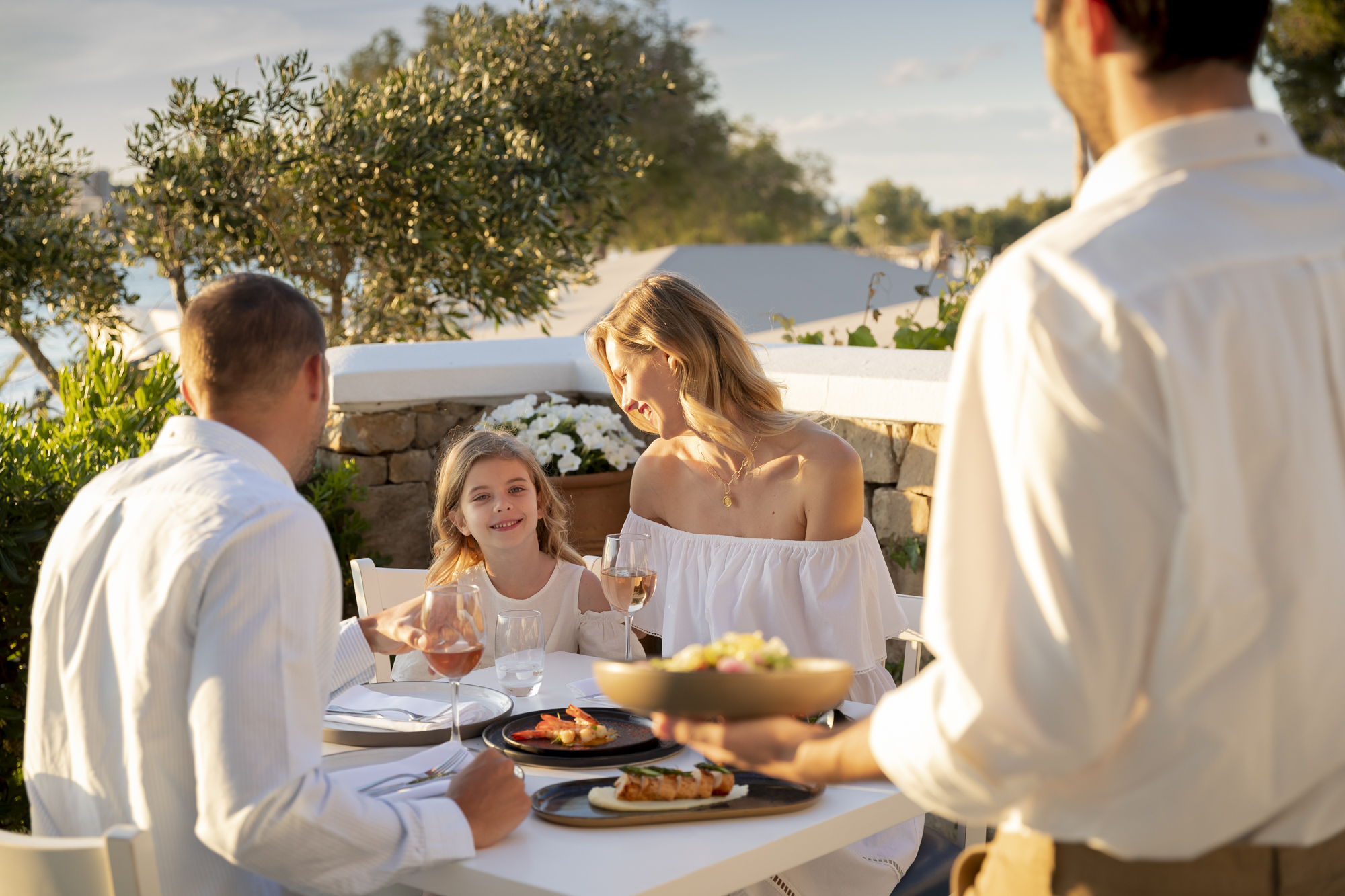 Family eating at Ouzeri Sani Beach