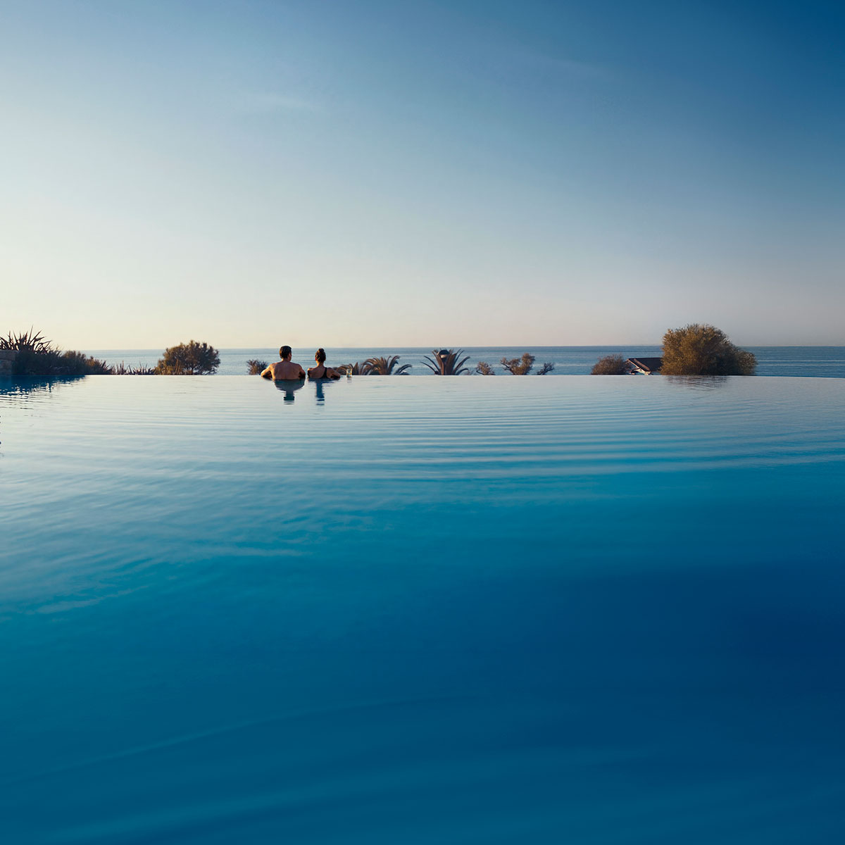 Cocktail glass against Mount Olympus at Sani