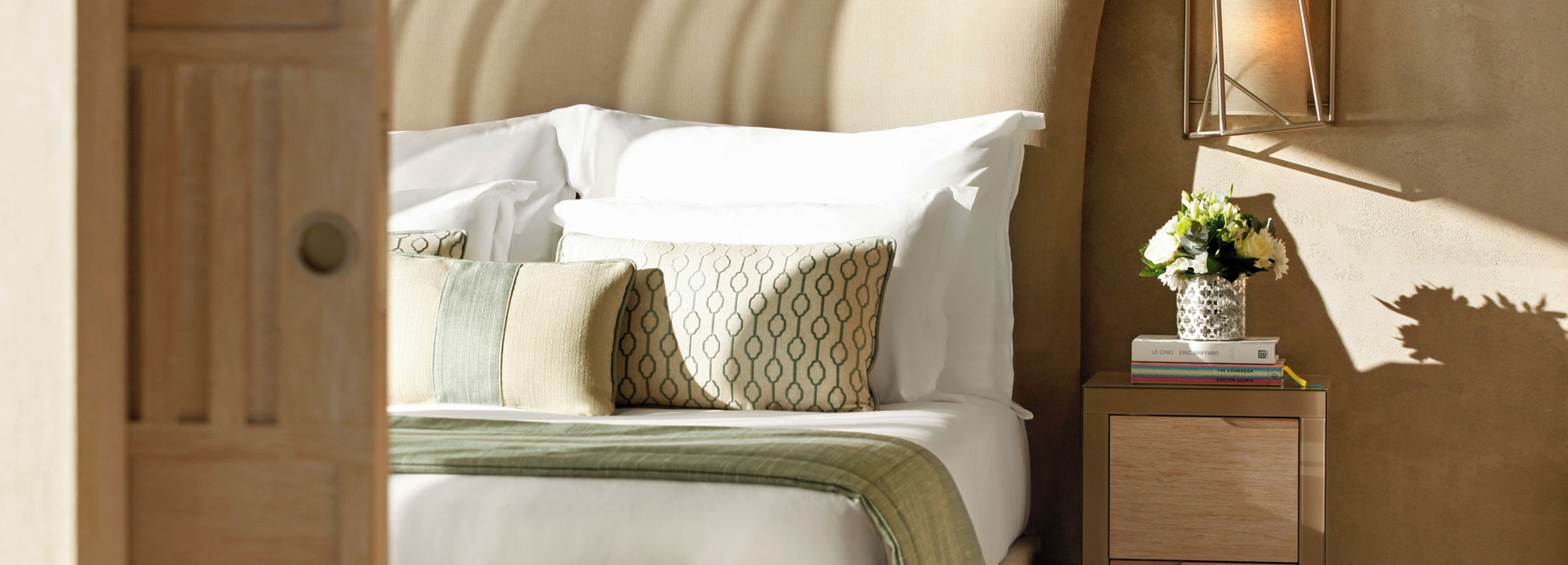 Close up of double bed with cushions