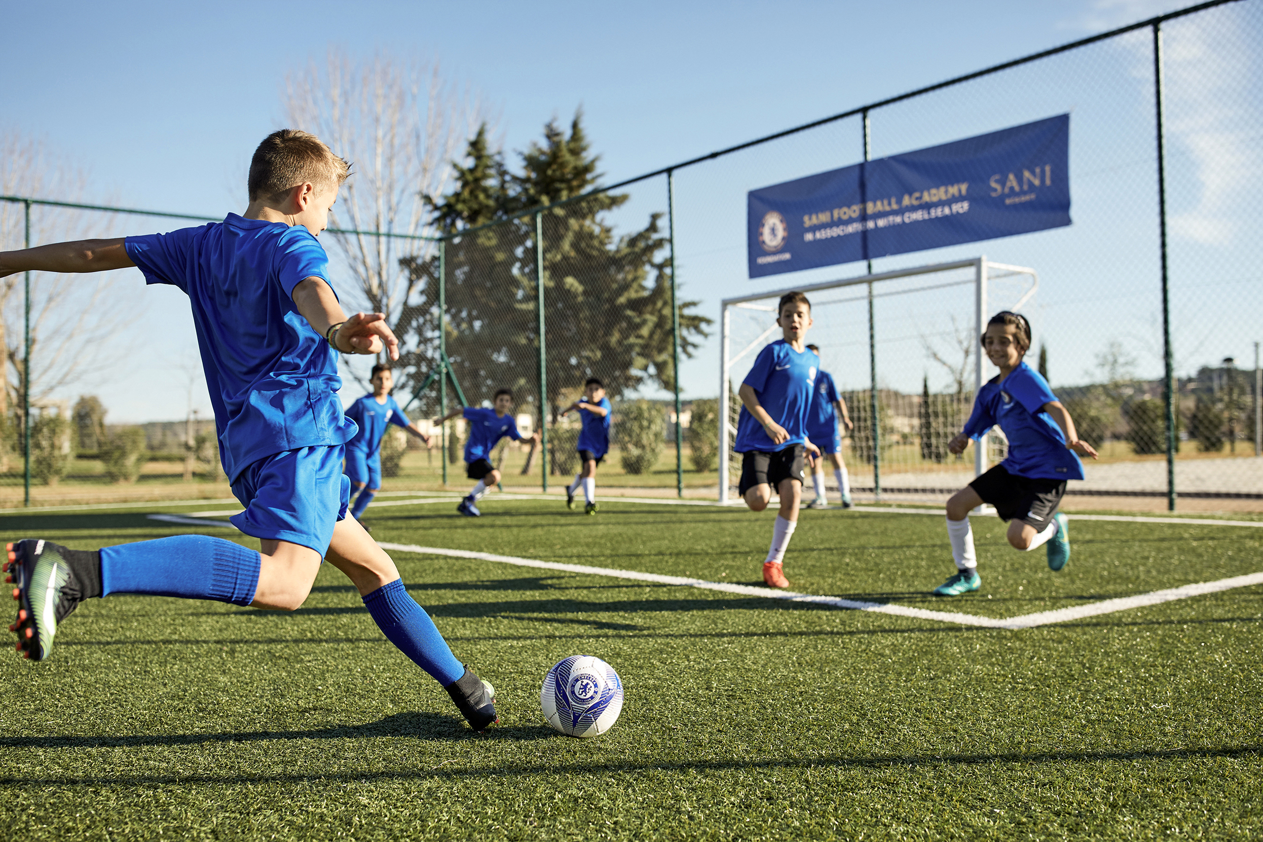 Kid kicking ball at Chelsea FC Academy at Sani Resort