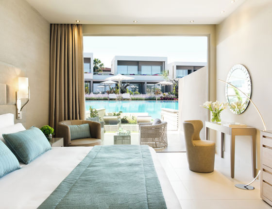 Family room with view of private garden at Sani Dunes