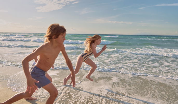 Two girls playing in the water at Sani Beach