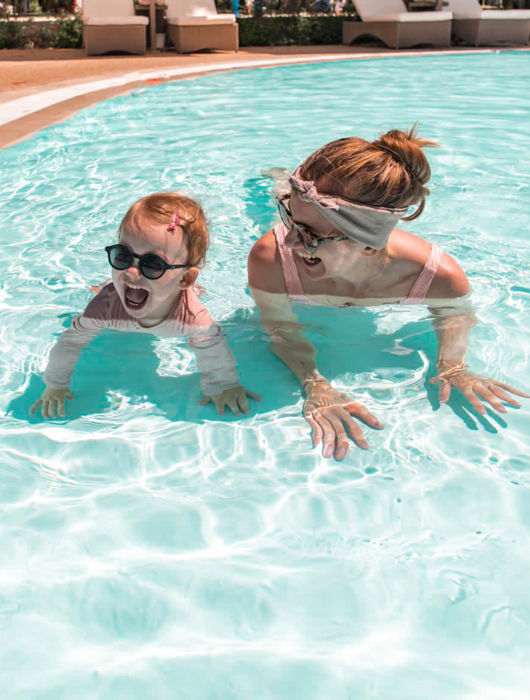 Mother playing with son in the sea