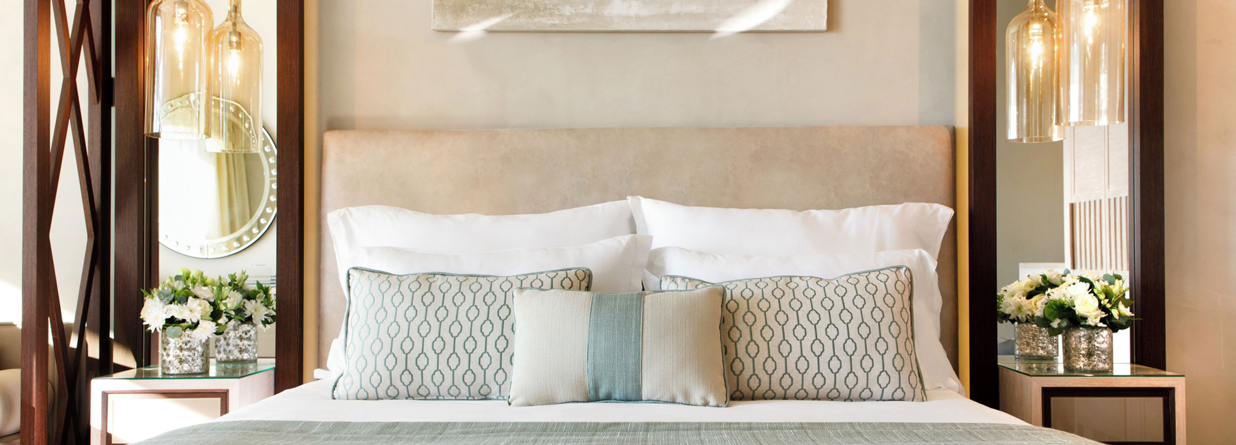 Close up of double bed with cushions