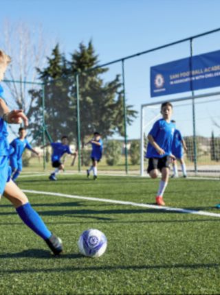 Teens playing football at Sani Chelsea FC