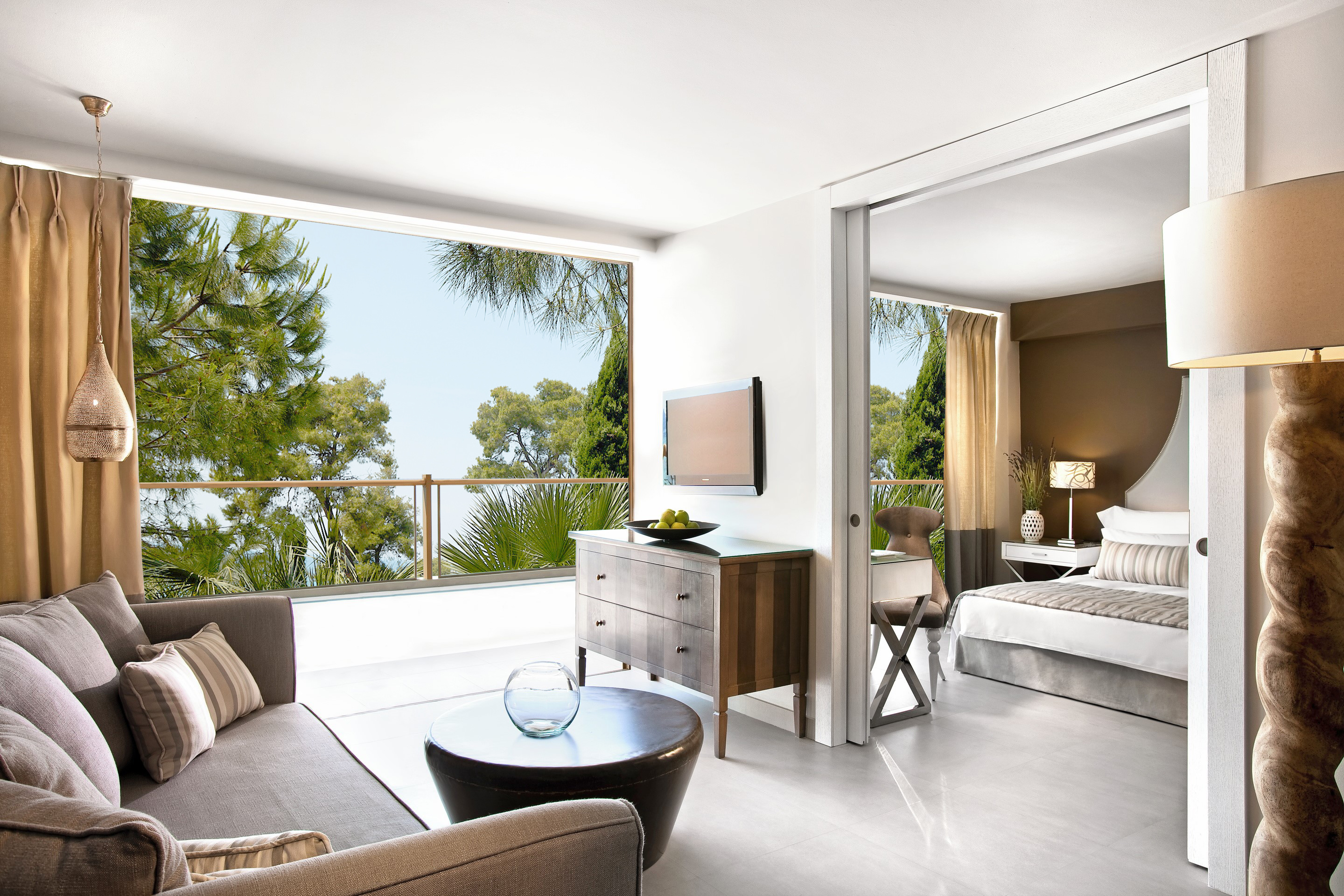 Family room with furnishings with garden view