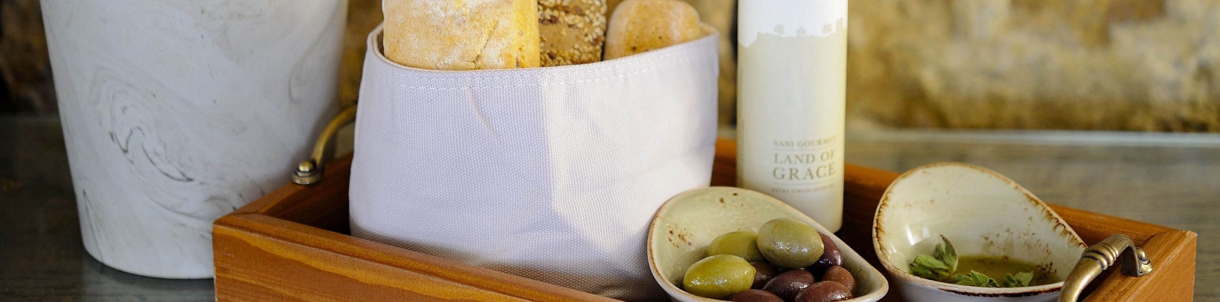 Platter with rustic bread, olives and truffle oil