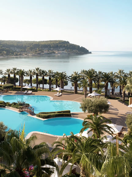 Sani beach pool with umbrella