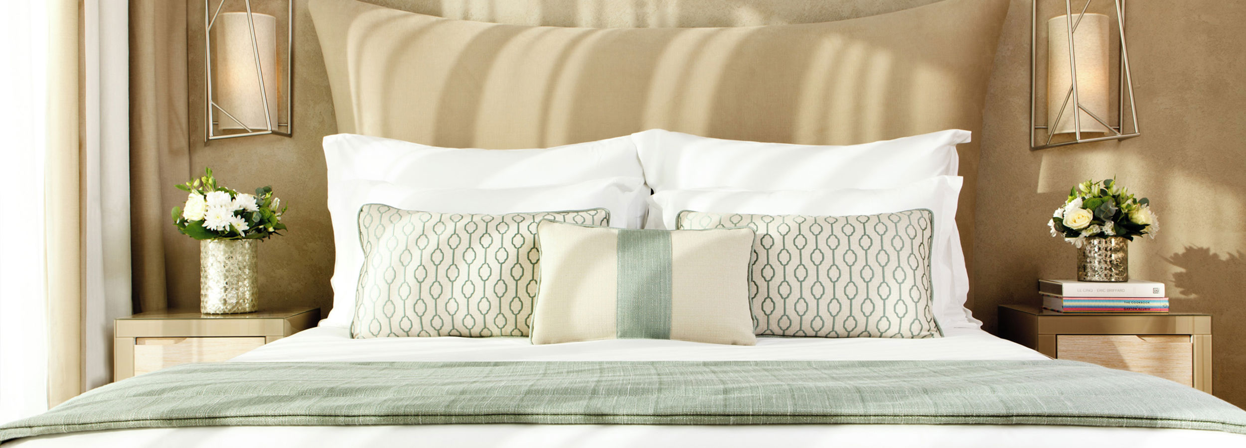 Close up of double bed with cushions