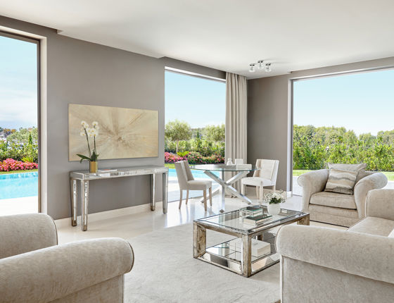 Large reception area in three bedroom family suite with private pool