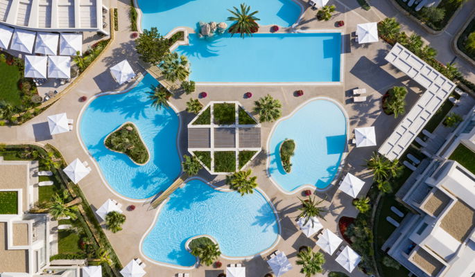 Close up of room furnishings, cushion lamp and flower