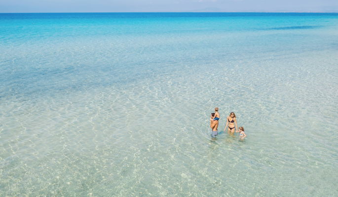 A family walking in the sea