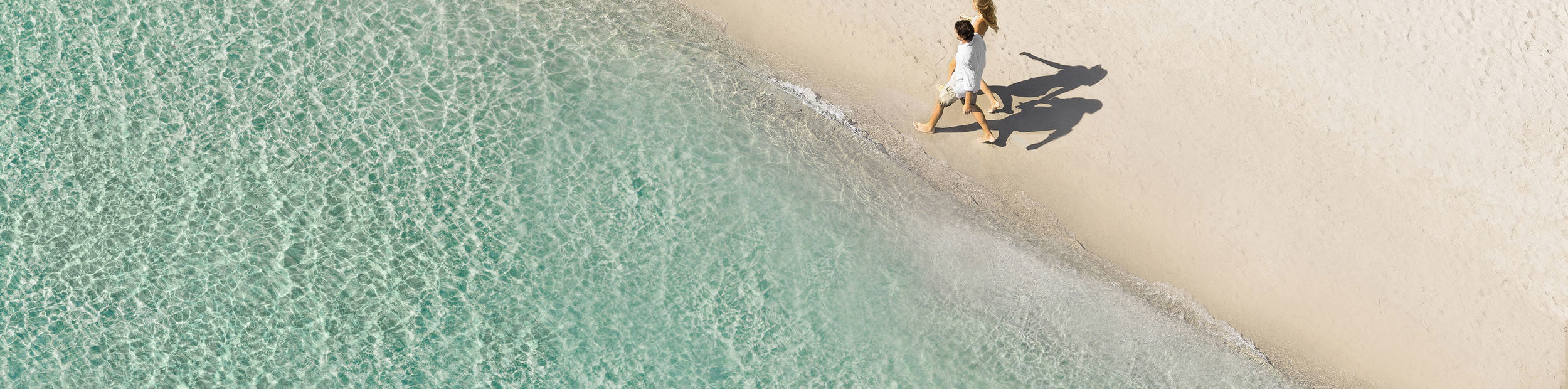 Couple walking on the beach
